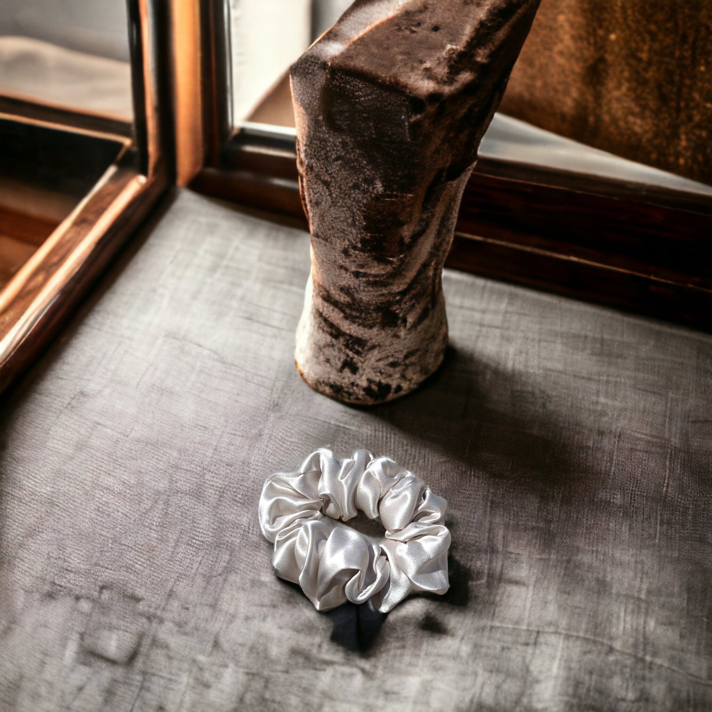 Premium mulberry silk scrunchie, offering gentle hold and protecting hair from damage while adding an elegant touch to your style.