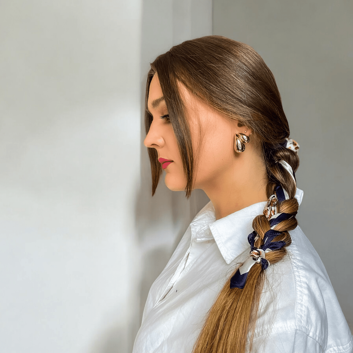 model wearing dimo Silk scarf on braided hair