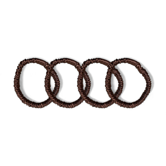 Set of 4 brown mulberry silk skinny hair ties, designed to prevent hair breakage and frizz, offering a sleek and stylish way to keep your hair in place.